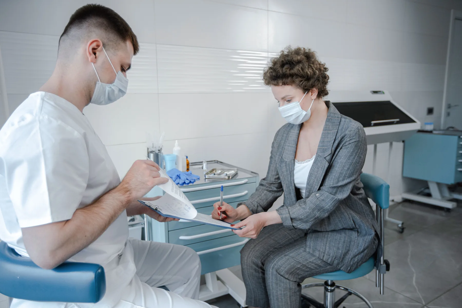 Dentist talking with a patient